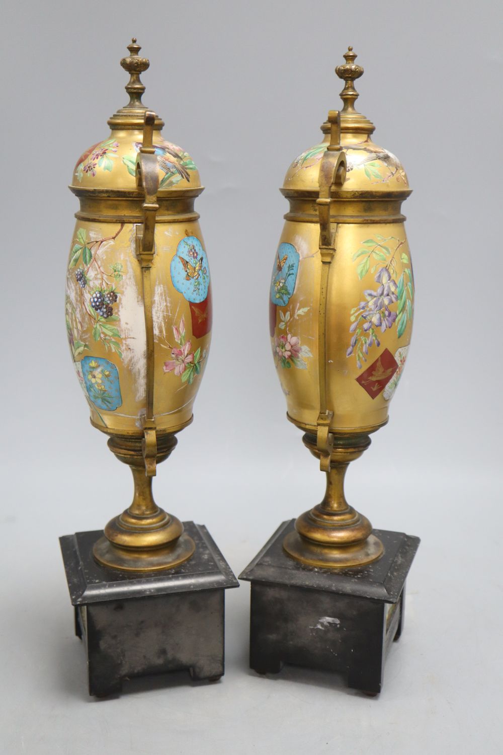 A pair of Victorian Aesthetic movement gilt metal and porcelain vases, height 40cm